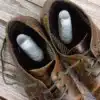 image of stinky feet inside leather brown shoes
