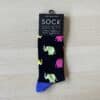 black sock with blue and pink elephants on them. facing right