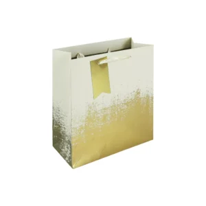Medium cream and gold distressed gift bag with satin ribbon handles and matching gold tag — stylish packaging for luxury gifts.