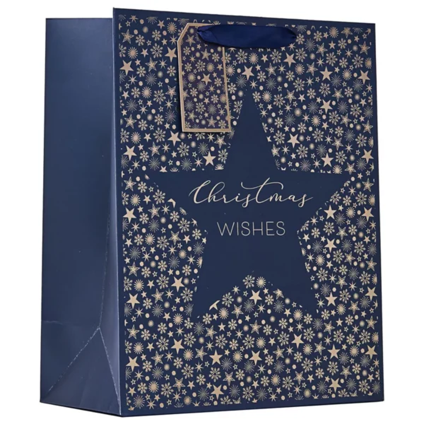 Small navy Christmas Wishes gift bag with gold foil star pattern, matching tag, and ribbon handles — elegant and festive for small gifts.