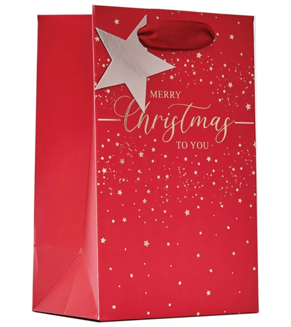 Small red Merry Christmas gift bag with gold foil stars, elegant script, matching star tag and ribbon handles — perfect for festive gifting.