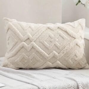 Vanilla sand beige lumbar cushion with criss cross texture, styled on a sofa
