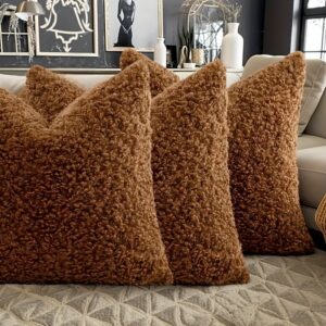 Warm mocha teddy cushion with a soft plush texture, styled on a sofa