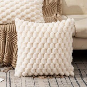 Neutral woven cushion in a soft beige tone, styled on a sofa in a modern living space